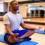 Yoga class a cross legged palms up meditation position