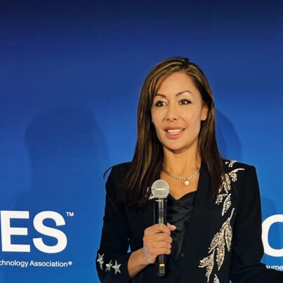 Susan Sly, AI keynote speaker, delivering a keynote on the CES stage