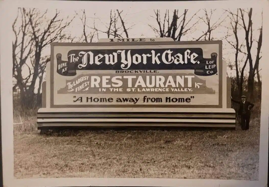 Vintage roadside billboard for The New York Cafe in Brockville, an early lesson in how a small business gets found, decades before AI search